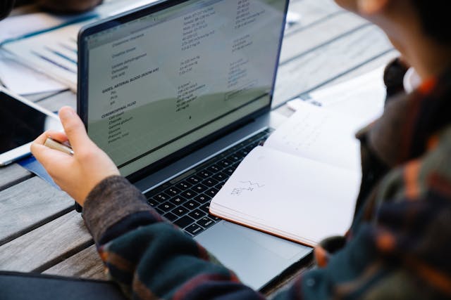 Student reviewing notes on a laptop, study abroad in Florence
